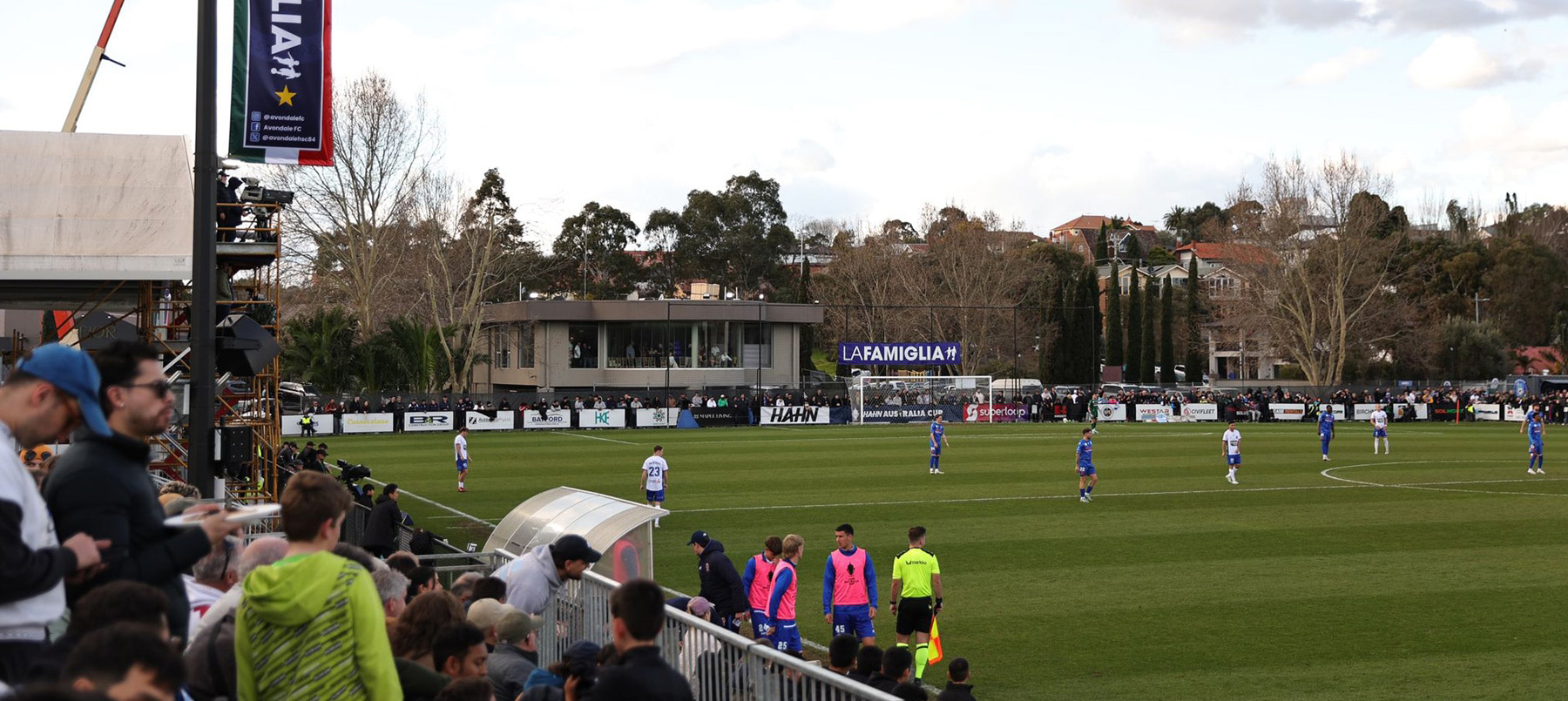 Avondale FC fans pack the stands as players compete on the pitch at Avenger Park.